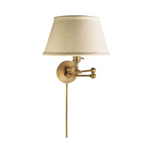 Load image into Gallery viewer, Boston Swing Arm Linen Shade Wall Light in Hand-Rubbed Antique Brass.
