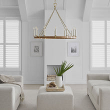 Load image into Gallery viewer, Darlana Rattan Wrapped Ringed LED  Chandelier in living room.
