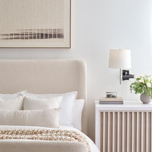 Load image into Gallery viewer, Elle LED Swing Arm Wall Light in bedroom.
