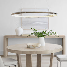 Load image into Gallery viewer, Encircle LED Chandelier in living room.
