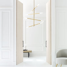 Load image into Gallery viewer, Rousseau Articulating LED Chandelier in living room.
