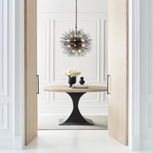 Load image into Gallery viewer, Strada Chandelier in living room.
