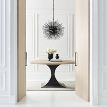 Load image into Gallery viewer, Strada Chandelier in living room.
