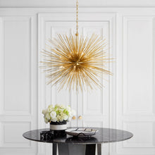 Load image into Gallery viewer, Strada Chandelier in living room.
