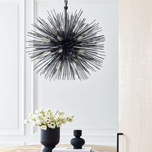 Load image into Gallery viewer, Strada Chandelier in living room.
