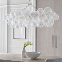 Load image into Gallery viewer, Talia LED Linear Chandelier in dining room.
