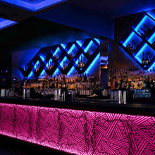 Load image into Gallery viewer, InvisiLED RGBWW Tape Light in restaurant.
