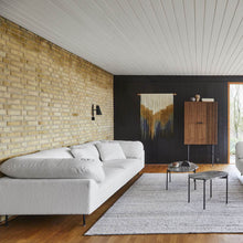 Load image into Gallery viewer, Cono Wall Light in living room.
