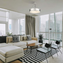 Load image into Gallery viewer, Anders LED Semi Flush Mount Ceiling Light in living room.
