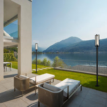 Load image into Gallery viewer, Aura Outdoor Lean Post Light in Outside Area.
