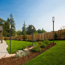 Load image into Gallery viewer, Aura Outdoor Post Light in Outside Area.
