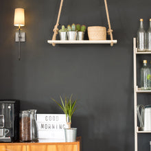 Load image into Gallery viewer, Camila Wall Light in living room.
