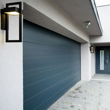 Load image into Gallery viewer, Luttrel Outdoor LED Wall Light in Outside Area.
