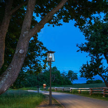 Load image into Gallery viewer, Rainer Outdoor Round Post Light in Outside Area.
