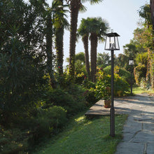 Load image into Gallery viewer, Rainer Outdoor Round Post Light in Outside Area.
