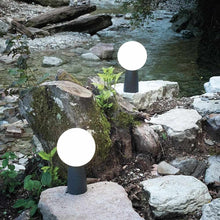 Load image into Gallery viewer, Olimpia LED Table Lamp in Outside Area.
