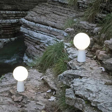 Load image into Gallery viewer, Olimpia LED Table Lamp in Outside Area.
