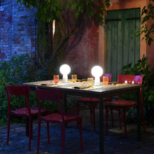 Load image into Gallery viewer, Olimpia LED Table Lamp in Outside Area.
