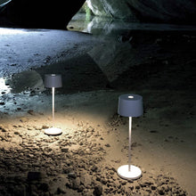 Load image into Gallery viewer, Olivia Pro LED Table Lamp in Outside Area.
