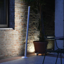 Load image into Gallery viewer, Pencil Light LED Floor Lamp in Outdoor Area.
