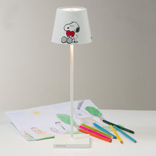 Load image into Gallery viewer, Poldina X Peanuts LED Table Lamp in living room.
