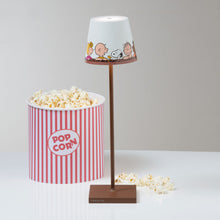 Load image into Gallery viewer, Poldina X Peanuts LED Table Lamp in living room.
