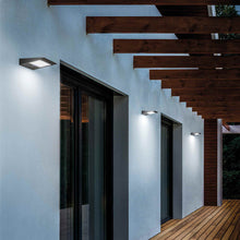 Load image into Gallery viewer, Solar Outdoor LED Wall Light in Outdoor Area.
