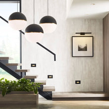 Load image into Gallery viewer, Akova Grande Pendant Light in living room.
