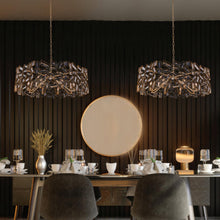 Load image into Gallery viewer, Inclanta Pendant Light in living room.
