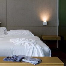 Load image into Gallery viewer, Alpha Wall Sconce in bedroom.
