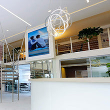 Load image into Gallery viewer, Copernico LED Suspension Light in living room.
