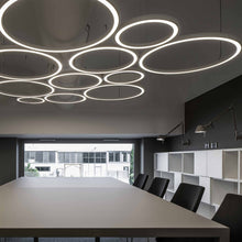 Load image into Gallery viewer, Ripple LED Cluster Pendant Light in office.
