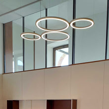 Load image into Gallery viewer, Ripple LED Cluster Pendant Light in living room.
