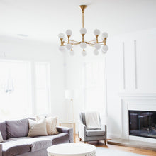 Load image into Gallery viewer, Astoria LED Chandelier in living room.
