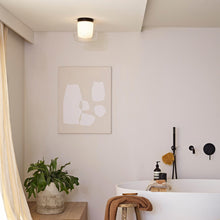 Load image into Gallery viewer, Aquina LED Semi Flush Mount Ceiling Light in bathroom.
