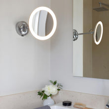 Load image into Gallery viewer, Mascali Round LED Magnifying Mirror in bathroom.
