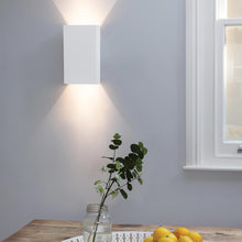 Load image into Gallery viewer, Rio LED Wall Light in living room.
