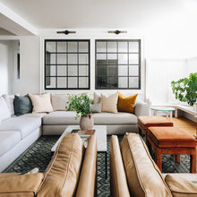 Load image into Gallery viewer, Atlas Wall Light in living room.
