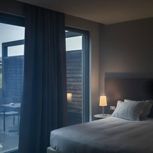 Load image into Gallery viewer, Birdie Easy LED Table Lamp in bedroom.
