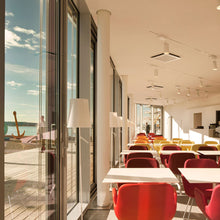 Load image into Gallery viewer, Birdie Lettura LED Floor Lamp in dining room.
