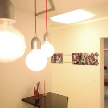 Load image into Gallery viewer, Ilde S1 Pendant Light in living room.
