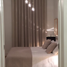 Load image into Gallery viewer, Lola T Table Lamp in bedroom.
