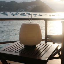 Load image into Gallery viewer, Misko Camp LED Table Lamp in Outside Area.
