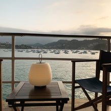 Load image into Gallery viewer, Misko Camp LED Table Lamp in Outside Area.
