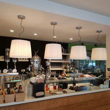 Load image into Gallery viewer, Royal S Pendant Light in restaurant.
