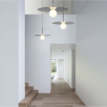Load image into Gallery viewer, Bola LED Disc Pendant Light in exhibition.
