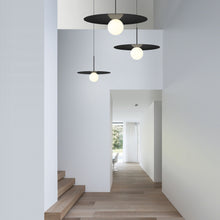 Load image into Gallery viewer, Bola LED Disc Pendant Light in exhibition.
