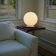 Load image into Gallery viewer, Bola Sphere LED Table Lamp in living room.
