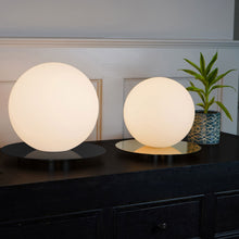 Load image into Gallery viewer, Bola Sphere LED Table Lamp in living room.
