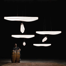 Load image into Gallery viewer, Lenis LED Linear Pendant Light in exhibition.
